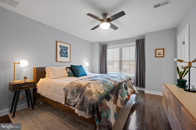 bedroom with ceiling fan and dark hardwood / wood-style flooring