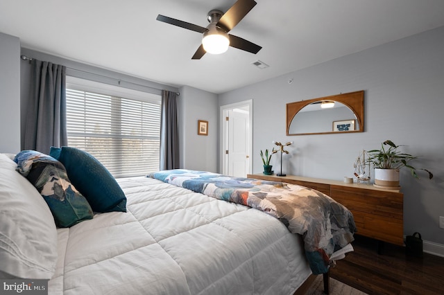 bedroom with ceiling fan and hardwood / wood-style flooring