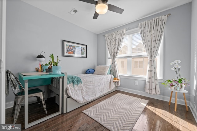 bedroom featuring ceiling fan and dark wood-type flooring