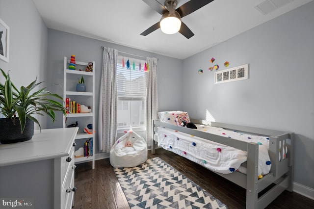 bedroom featuring dark wood-type flooring and ceiling fan