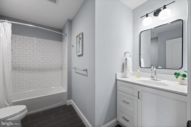 full bathroom featuring toilet, vanity, and shower / tub combo