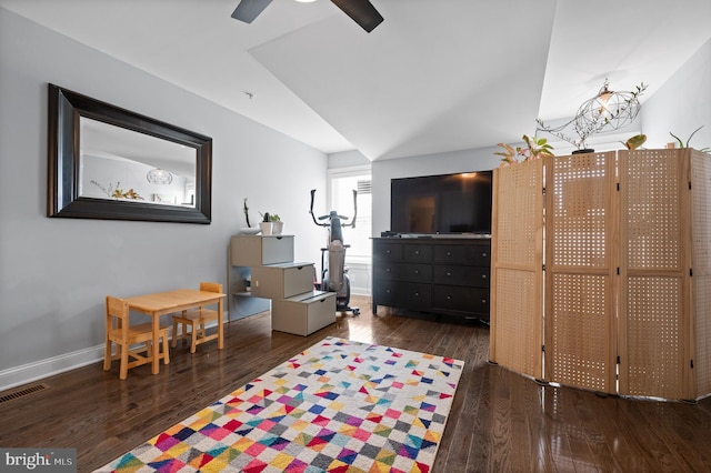 recreation room with ceiling fan and dark hardwood / wood-style flooring