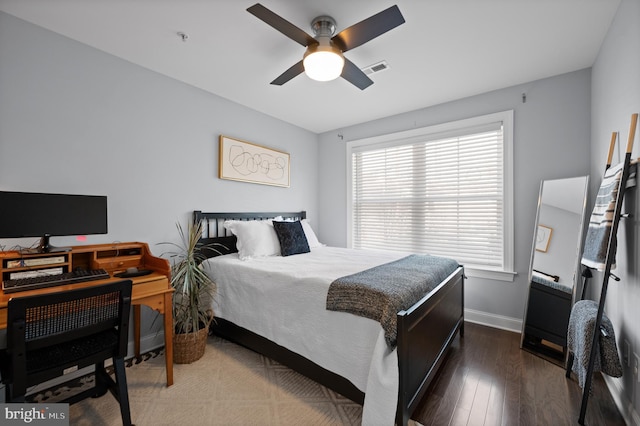 bedroom with dark wood-type flooring and ceiling fan