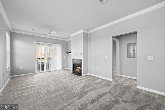 unfurnished living room with ceiling fan, crown molding, and carpet flooring