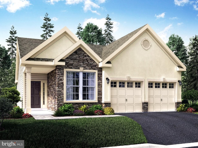 view of front of house featuring a front lawn and a garage