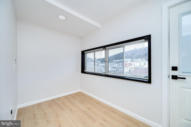 unfurnished room featuring light hardwood / wood-style floors