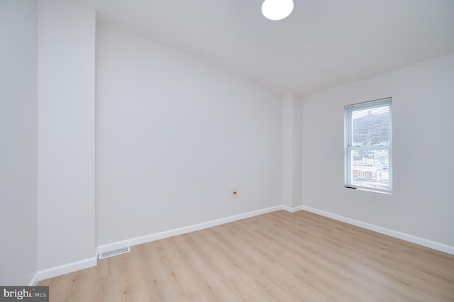 unfurnished room with light hardwood / wood-style floors