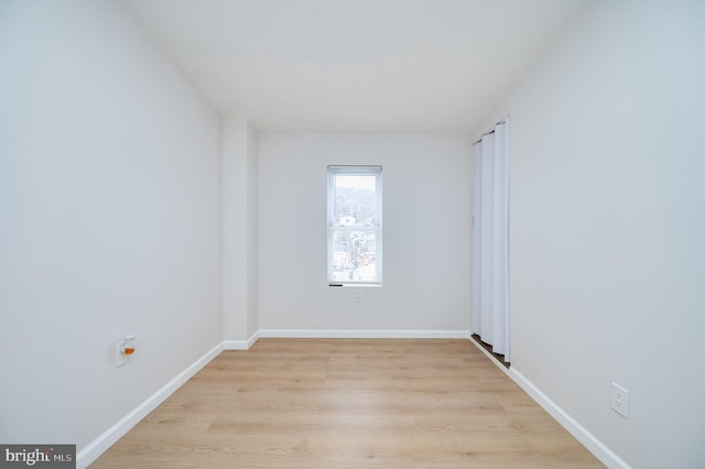 empty room with light wood-type flooring