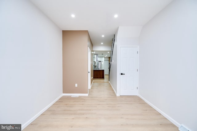 corridor featuring light hardwood / wood-style flooring