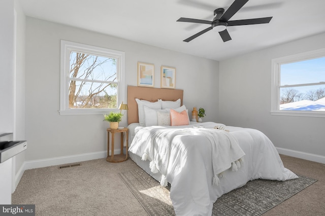 carpeted bedroom with ceiling fan