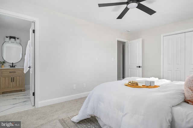 bedroom featuring ceiling fan, light colored carpet, and a closet