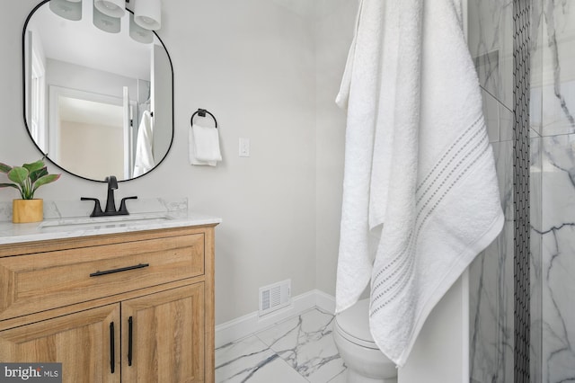 bathroom featuring a shower and vanity