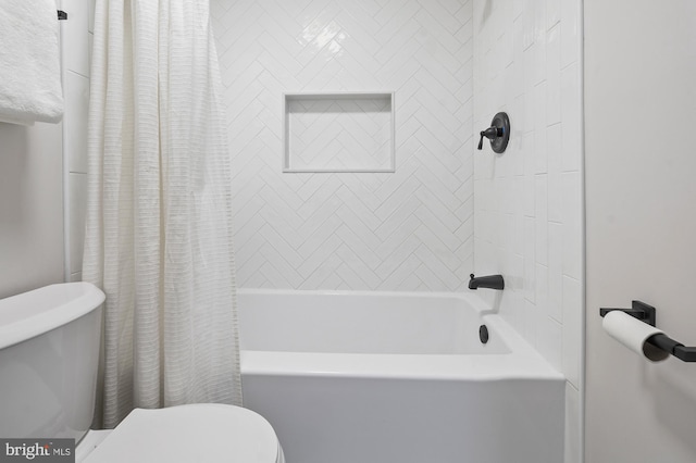 bathroom with toilet and shower / bath combination with curtain