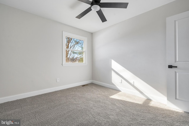 empty room featuring ceiling fan and carpet floors