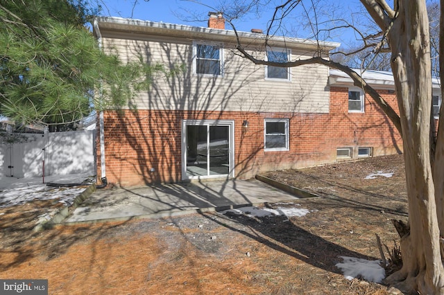 back of house with a patio