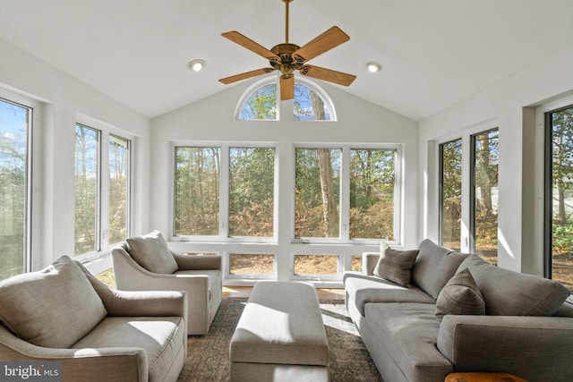 sunroom / solarium with a ceiling fan and vaulted ceiling