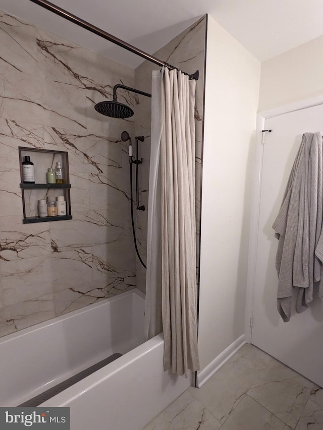 bathroom with shower / bath combo and marble finish floor