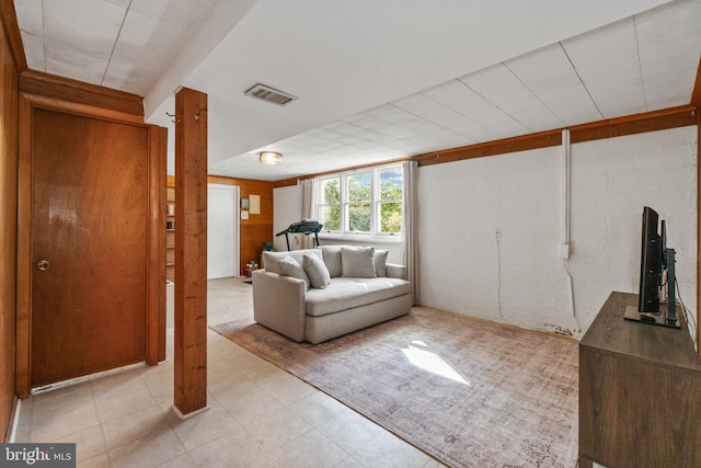 unfurnished living room with visible vents and light floors