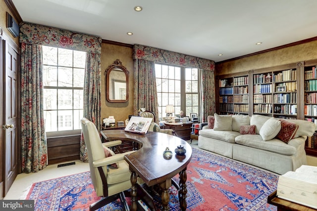 office featuring ornamental molding and light colored carpet