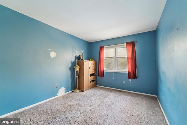 unfurnished bedroom with carpet flooring