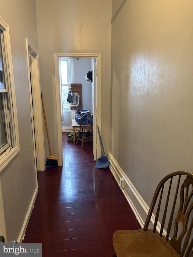 hall with dark hardwood / wood-style flooring