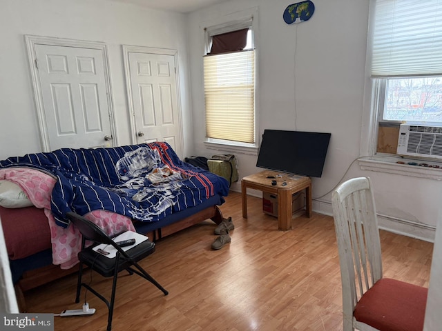 interior space with hardwood / wood-style floors and cooling unit