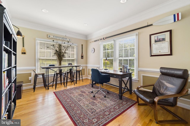 office with hardwood / wood-style flooring and crown molding