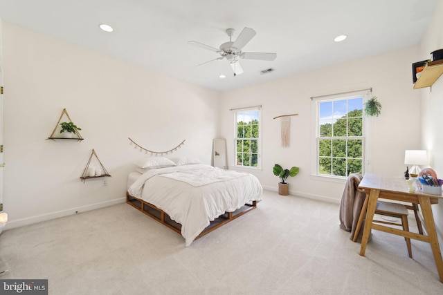 carpeted bedroom with ceiling fan