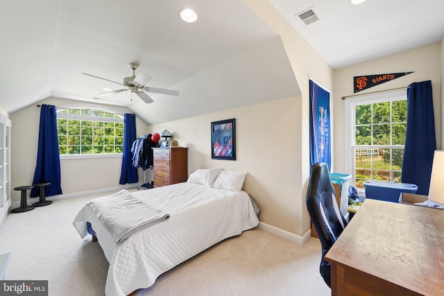 carpeted bedroom featuring lofted ceiling and ceiling fan