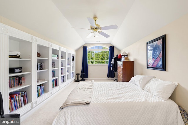 carpeted bedroom featuring lofted ceiling and ceiling fan