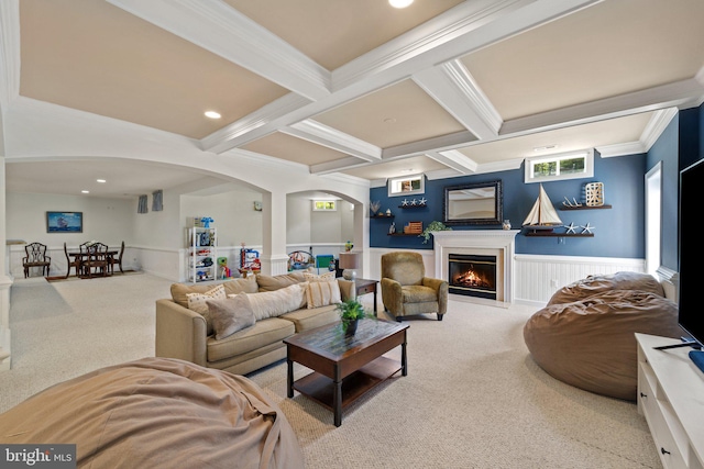 living room featuring beamed ceiling, crown molding, coffered ceiling, and light colored carpet