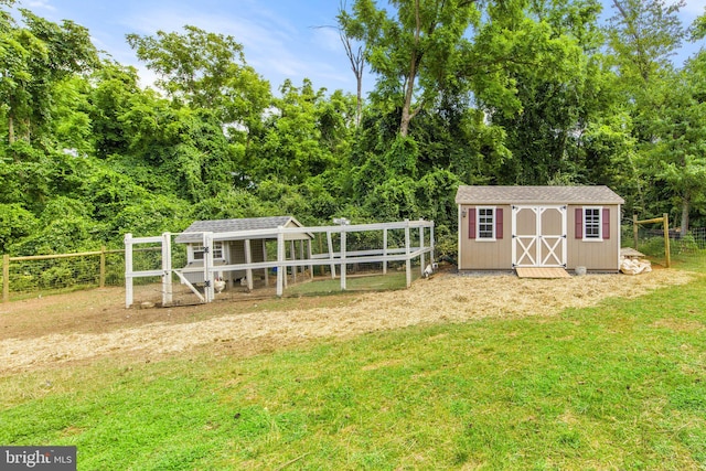 view of outbuilding featuring a yard