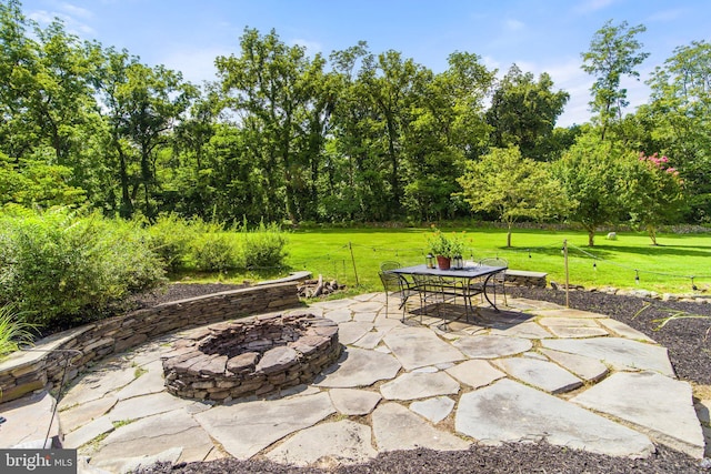 view of patio with a fire pit