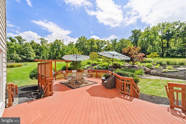 wooden deck with a lawn