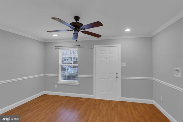 spare room featuring ceiling fan, ornamental molding, and hardwood / wood-style floors