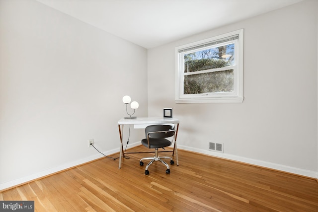 office area with hardwood / wood-style flooring