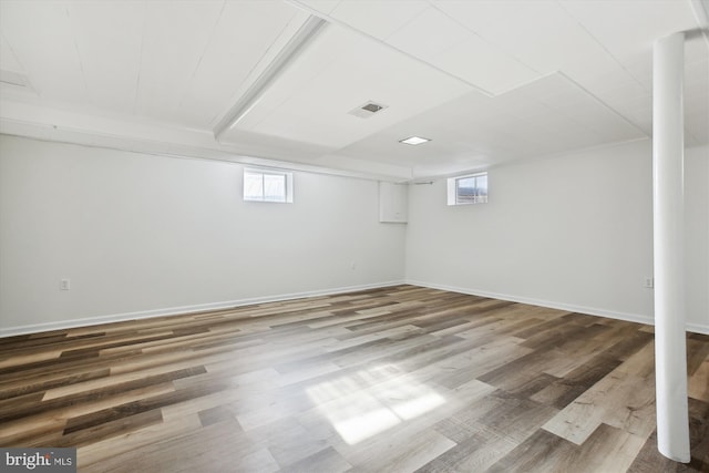 basement featuring hardwood / wood-style flooring