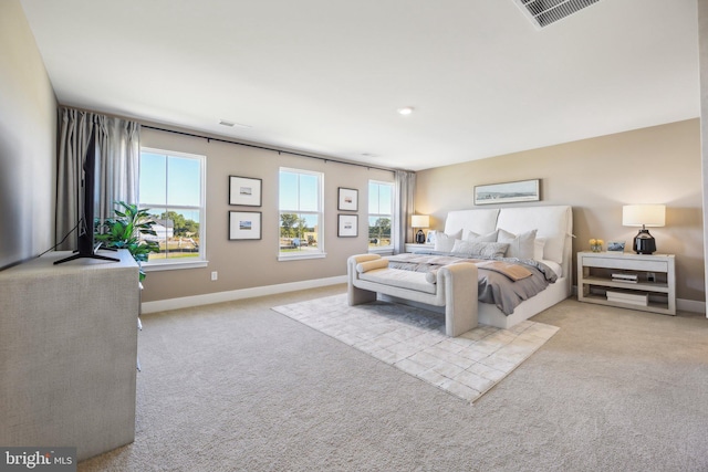 bedroom featuring light carpet