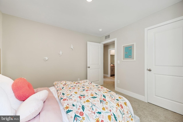 bedroom featuring light carpet