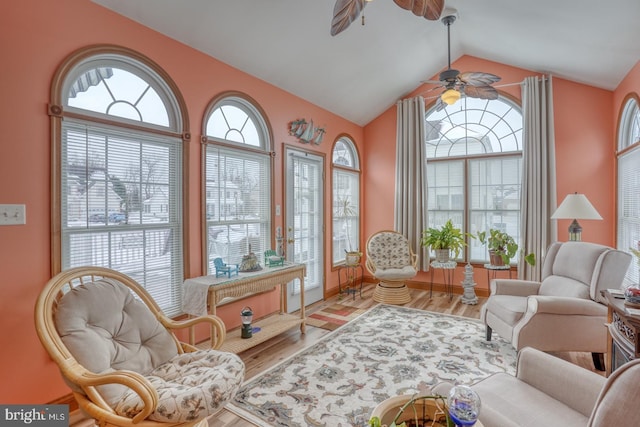 interior space with ceiling fan and vaulted ceiling