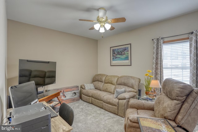 carpeted living room featuring ceiling fan