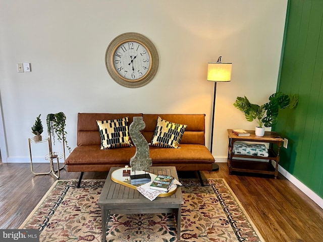 living room with dark hardwood / wood-style flooring