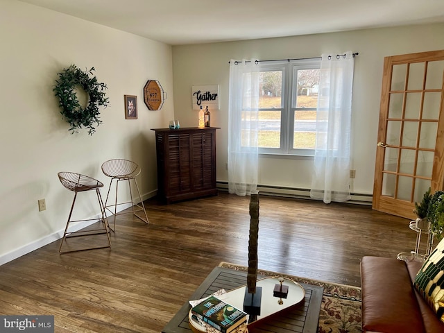 sitting room featuring dark wood-type flooring