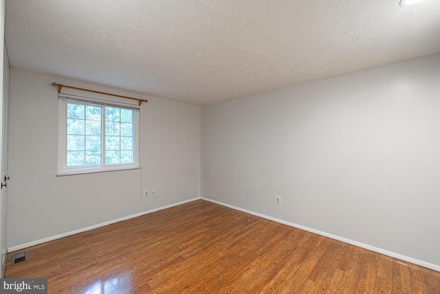 9416 Mirror Pond Dr, Fairfax, VA 22032 - unfurnished room with wood finished floors and a textured ceiling
