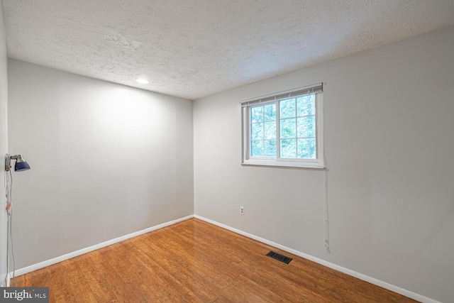 9416 Mirror Pond Dr, Fairfax, VA 22032 - spare room with a textured ceiling, wood finished floors, and recessed lighting
