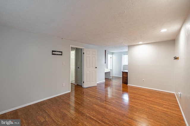 9416 Mirror Pond Dr, Fairfax, VA 22032 - empty room with a textured ceiling, wood finished floors, and recessed lighting
