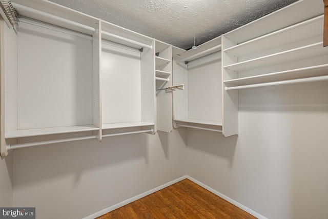 9416 Mirror Pond Dr, Fairfax, VA 22032 - walk in closet featuring wood finished floors
