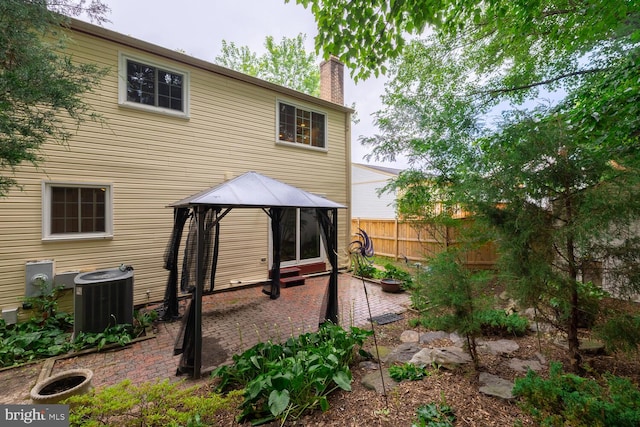 9416 Mirror Pond Dr, Fairfax, VA 22032 - back of house featuring a gazebo, a chimney, and a patio area