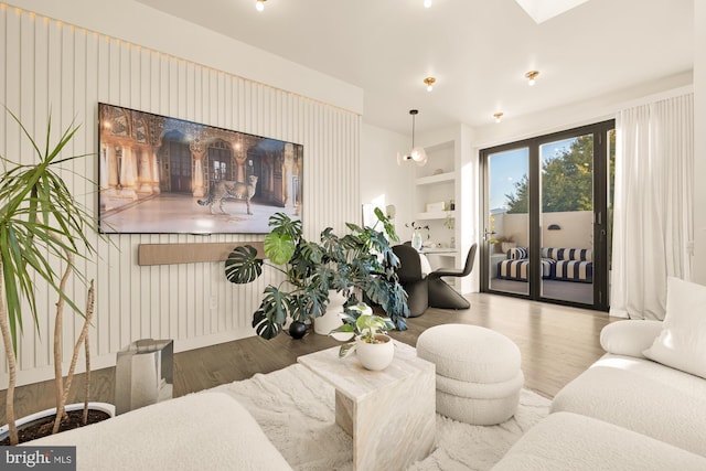 living room featuring hardwood / wood-style flooring and built in features