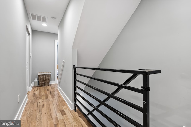 stairway featuring hardwood / wood-style floors